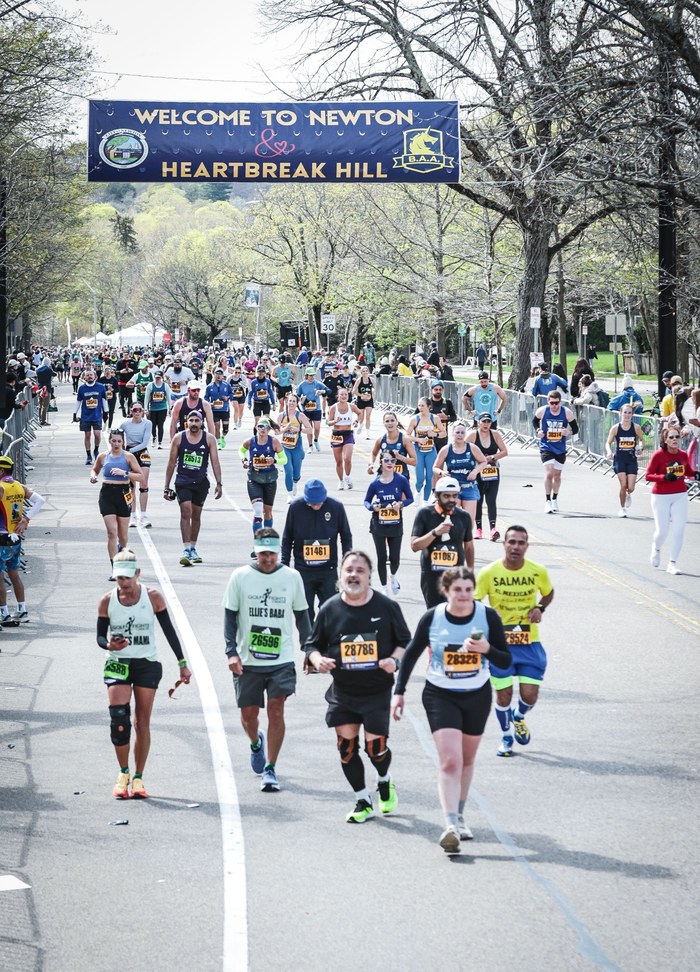 Runners passing Heartbreak Hill in the Boston Marathon